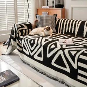 Bohemian chenille sofa cover with black and white geometric patterns in lifestyle setting