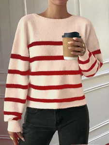 Close-up shot of a women's casual cream and red horizontal striped knit sweater