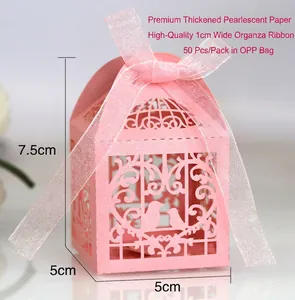 Detailed view of pink laser-cut bird candy box showing 5x5x7.5cm size and ribbon