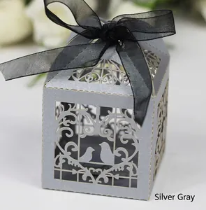 Elegant silver-gray laser-cut birdcage candy box with decorative black ribbon bow
