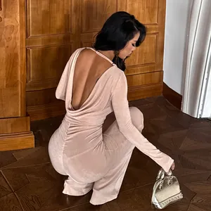 Elegant backless long-sleeve jumpsuit in nude beige with a slim fit and long pants