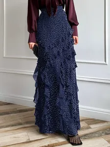 Elegant navy blue polka dot maxi skirt with cascading ruffle details for casual holiday style