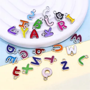 Close-up of colorful enamel alloy A-Z alphabet charms for DIY jewelry making.
