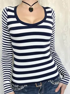 Blue and white horizontal striped long-sleeved T-shirt with deep scoop neckline.