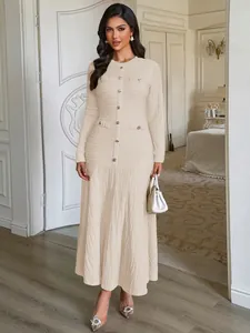 Elegant cream long-sleeved textured maxi dress with button details for autumn and winter