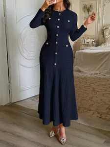 Elegant navy blue long-sleeved knitted dress featuring decorative gold button details