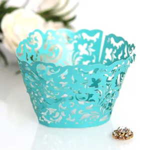Elegant blue laser-cut cupcake wrappers with intricate floral hollow lace for weddings