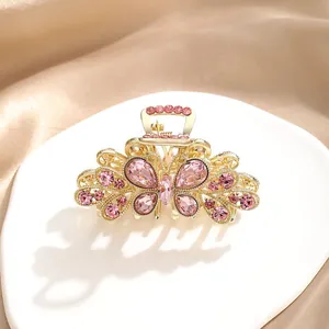 Elegant gold butterfly hair claw clip with pink rhinestones for women's half-up hair