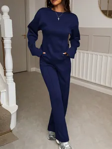 Detailed view of a navy blue two-piece lounge set for women featuring long sleeves and pants