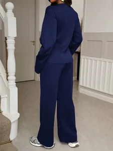 Back view of women's navy blue casual two-piece set featuring wide-leg trousers