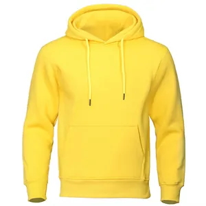 Close-up of plain yellow hooded pullover hoodie with kangaroo pocket and fleece texture.