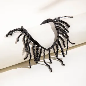 Detailed view of an elegant Gothic black beaded choker with multiple hanging tassels