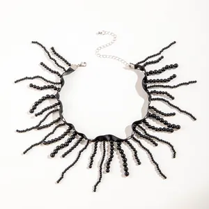 Detailed macro view of a gothic black beaded fringe choker necklace with adjustable chain