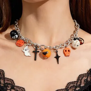 Gothic Halloween necklace with pumpkin, ghost, and skull charms on a silver chain