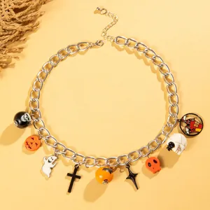 Retro gothic Halloween charm necklace featuring pumpkin, ghost, and skull pendants.