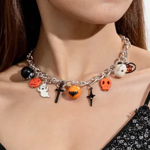 Close-up detail of a gothic Halloween choker necklace with ghost and pumpkin charms