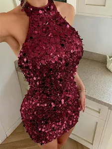Detailed view of shimmering burgundy sequins on an elegant halter neck bodycon evening mini dress