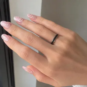 Elegant stainless steel band ring with inlaid black crystals worn on hand