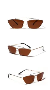 Lunettes de soleil œil de chat marron et monture dorée, vues sous trois angles.