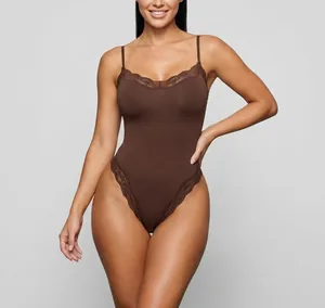 Full front view of a sexy brown lace-trim bodysuit on a model with seamless straps