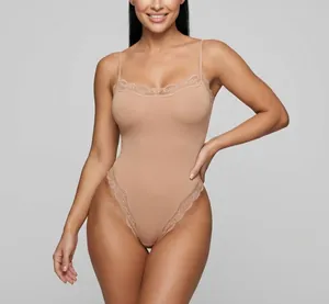 Detailed view of a nude-colored lace shapewear bodysuit featuring elegant thin straps