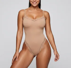 Close-up detail of lace trim on a nude seamless bodysuit with adjustable spaghetti straps