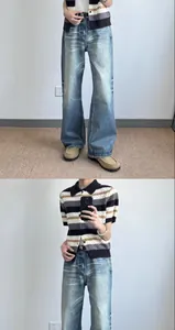 Mirror selfie showing fit of retro American style wide-leg jeans in light blue wash