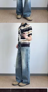 Detailed side view of vintage American style wide-leg blue denim jeans for men