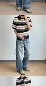 Men's retro loose wide-leg jeans featuring vintage wash and distressed denim style