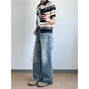 Vintage American style loose wide-leg denim jeans for men in a light washed blue finish