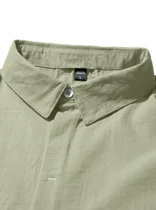 Close-up detail of the linen texture and collar on a men's sage green button-down shirt