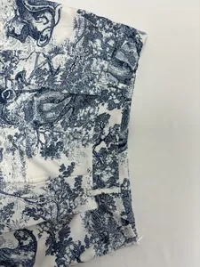 Close-up of blue and white Toile de Jouy printed waistband detail