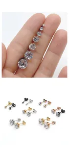 Macro detail of various sizes and multi-color stainless steel six-prong zircon stud earrings