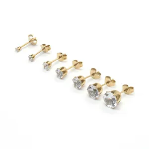 Set of seven gold stainless steel stud earrings with cubic zirconia in varying sizes