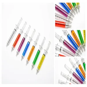Detailed close-up view of various colorful syringe ballpoint pens with measurement scales