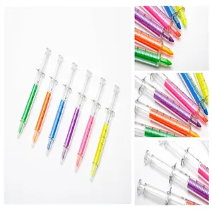 Close-up detail of creative syringe-shaped pens in six vibrant colors on white background