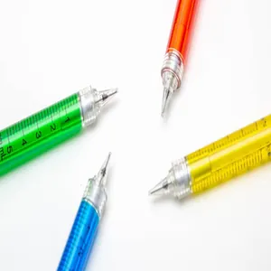 Close-up of colorful syringe-shaped ballpoint pens in green, blue, yellow, and red
