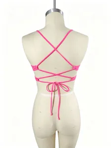 Rear view of vibrant pink sports bikini top featuring adjustable criss-cross back straps
