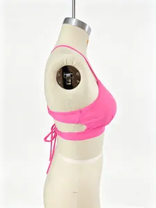 Side view of a vibrant pink sports bikini top with cross back tie straps on a mannequin