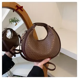 Chic brown crocodile embossed crescent shoulder bag for women with minimalist design