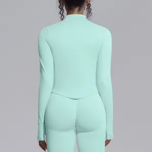 Back view detail of mint green seamless high-stretch mock neck yoga top for women
