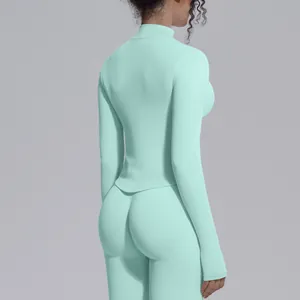 Back view of mint green seamless high-neck athletic top for yoga and fitness training.