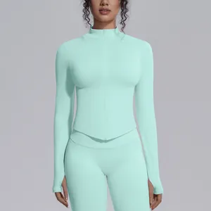 Close-up detail of mint green seamless high-stretch yoga jacket with stand collar and zipper