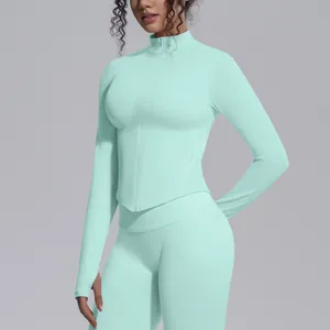 Macro view of mint green seamless high-stretch yoga jacket featuring stand collar and zipper