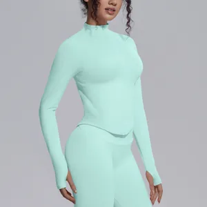 Detailed view of mint green seamless sports yoga jacket with thumbholes and stand collar