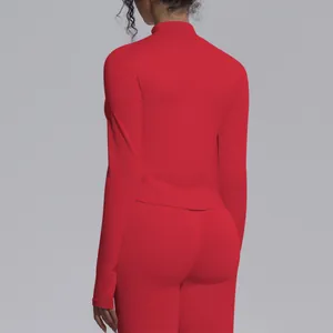 Professional rear view of red seamless long sleeve athletic yoga top and leggings set