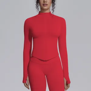 Detailed view of women's red seamless zip-up yoga top and matching high-waisted leggings