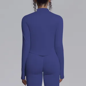 Back view of a premium blue seamless high-stretch long sleeve yoga top with thumbholes