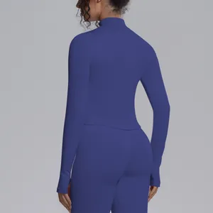 Blue seamless long sleeve yoga top for women with stand collar and thumb holes, back view.