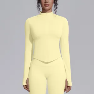 Seamless pale yellow yoga jacket with stand collar, full zipper, and thumb holes